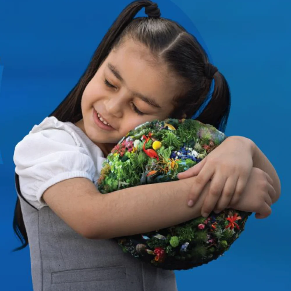 Child showing care for nature and sustainability.