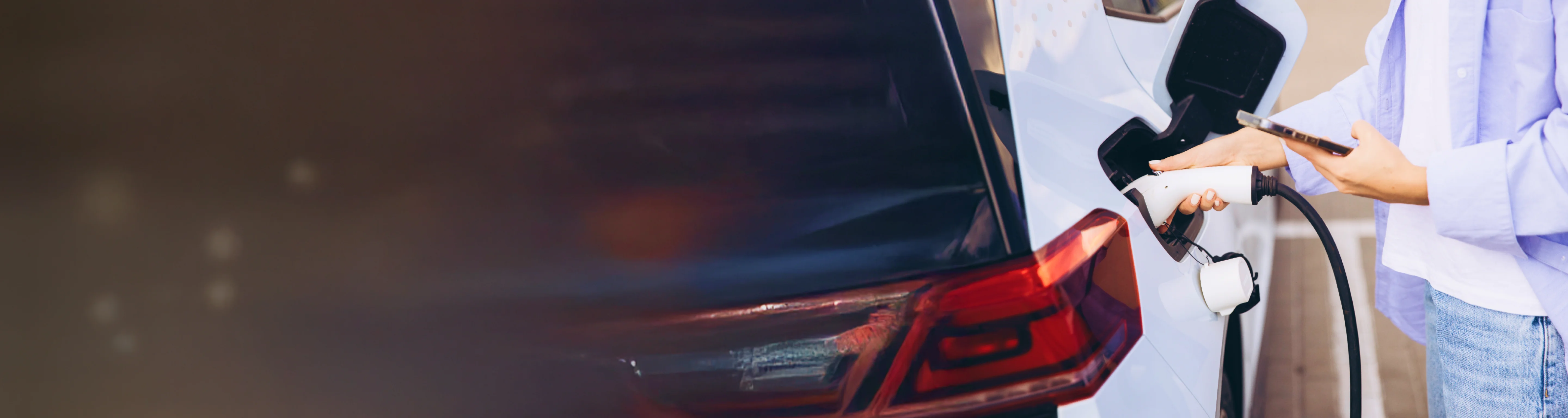 Charging an electric vehicle with a Tata Power EV charger, illustrating tips to extend EV battery life