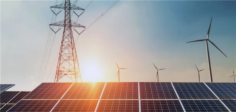Solar panels, wind turbines, and power lines showcasing clean energy and a sustainable future