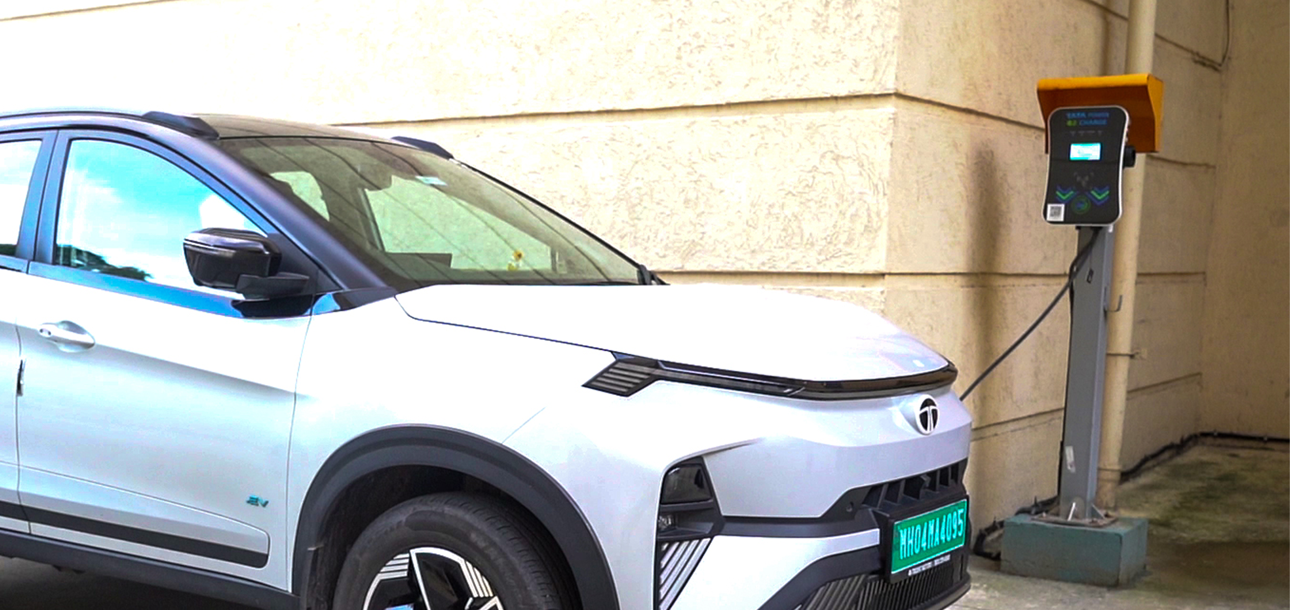 Electric car charging at a Tata Power EV charging station