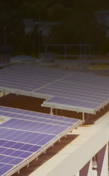 Solar panels generating power on building rooftop