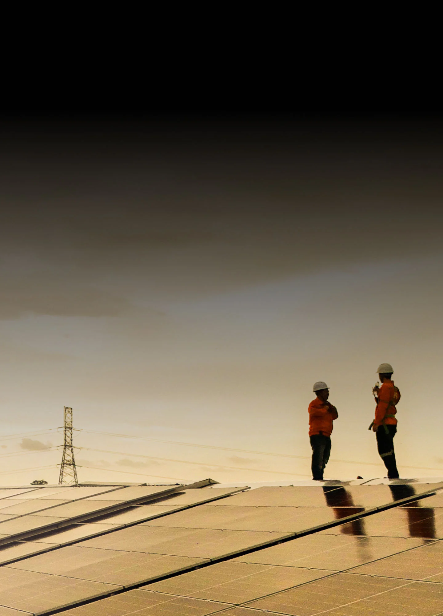 Technicians maintaining a solar microgrid for sustainable rural electrification