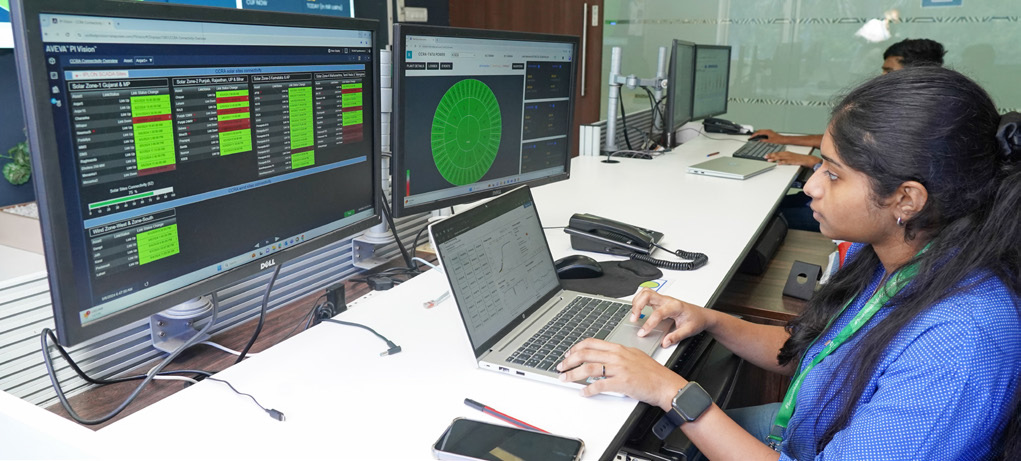 Employee working in control room